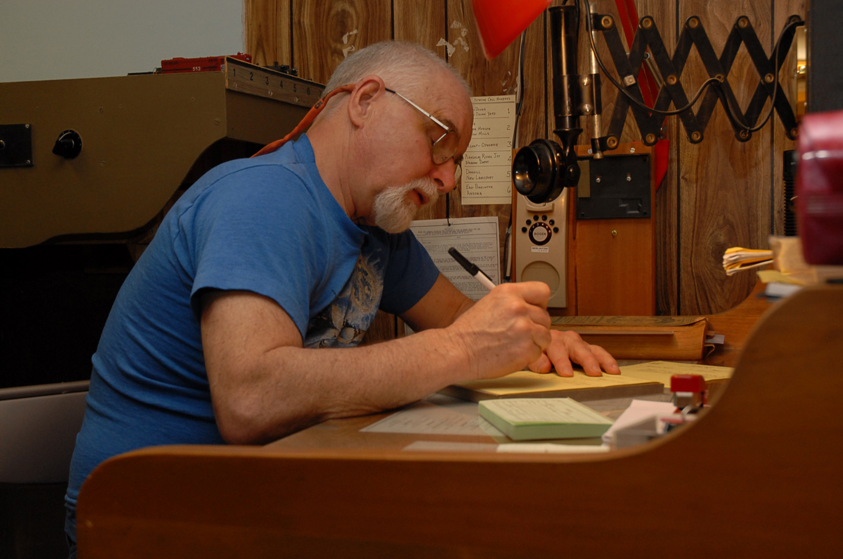 Jack Ozanich copying orders on his Atlantic Great Eastern
